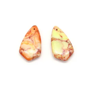 Detailed macro view of teardrop natural stone pendants with marble texture for DIY jewelry