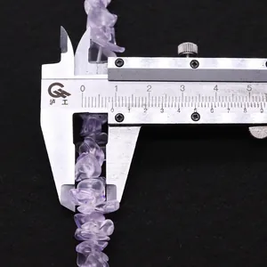 Macro shot of irregular lavender amethyst beads showing 7-8mm size measurement