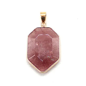 Close-up of hexagonal faceted strawberry quartz pendant with gold plated metal bail