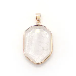 Macro detail of hexagonal strawberry quartz pendant with rose gold plated metal frame
