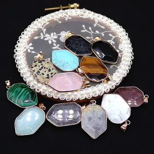 Variety of faceted natural stone shield pendants with gold electroplated borders