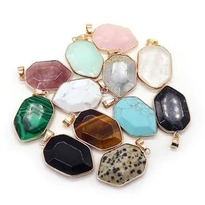 Set of multifaceted natural stone pendants in shield shapes with gold plated metal edges