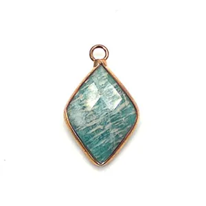 Macro detail of diamond-shaped amazonite gemstone pendant with rose gold plated metal edges