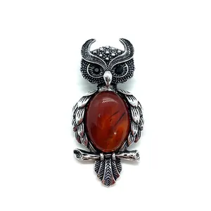 Detailed retro owl brooch with natural tiger eye stone and silver metal feather textures