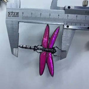 Macro view of dragonfly brooch wings showing size 4.8cm on a digital caliper scale
