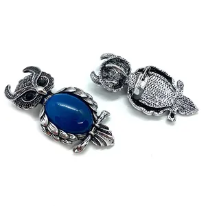 Antique silver owl brooch with natural blue stone and black rhinestone eyes
