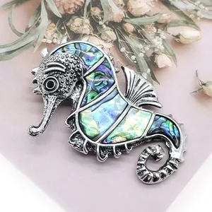 Exquisite seahorse brooch with natural abalone shell inlay and silver zinc alloy finish