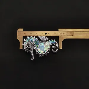 Macro shot of seahorse brooch with abalone shell inlay measuring approximately 55mm in length
