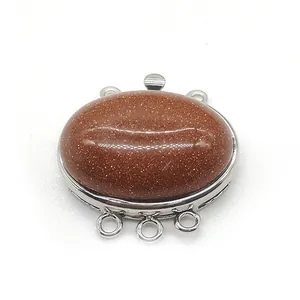 Detailed view of 3-strand goldstone oval clasp connector for multi-layer DIY jewelry