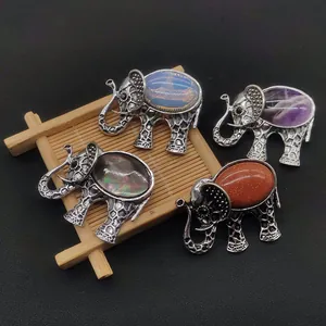 Vintage elephant brooches with natural stone inlays in antique silver finish on black set