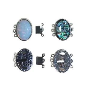 Zinc alloy triple-strand connector with natural shell and oval opal stone inlays