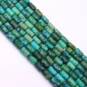 Macro detail of cylindrical turquoise stone beads with natural black marbled texture