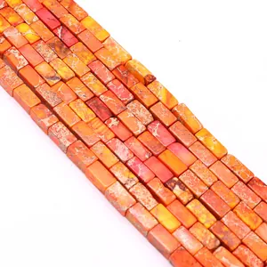 Macro shot of rectangular emperor stone beads for DIY jewelry in orange and red