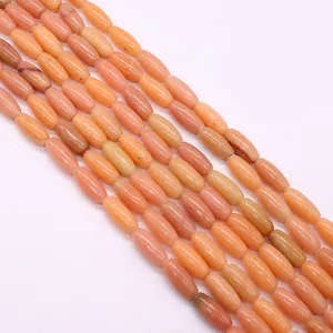 Gros plan de perles de pierre impériale orange poli pour la création de bijoux DIY