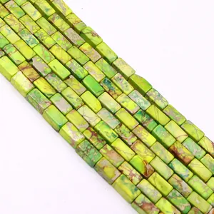 Macro shot of rectangular green emperor stone beads with natural marble texture for DIY