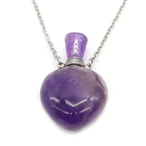 Detailed view of heart-shaped amethyst essential oil bottle necklace with silver chain