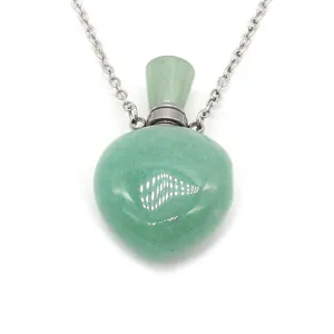 Green aventurine heart stone perfume bottle necklace with silver chain on white background