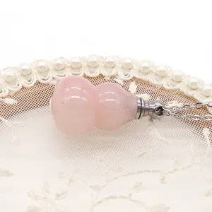 Collana con ciondolo a boccetta di profumo in cristallo rosa a forma di zucca