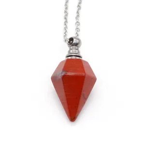 Macro view of red natural stone hexagonal perfume bottle necklace with silver chain