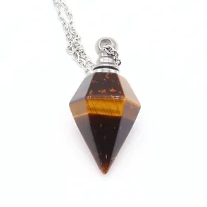 Macro view of a hexagonal tiger eye stone essential oil bottle pendant on silver chain
