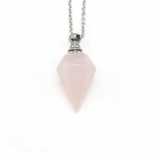 Pink crystal hexagonal cone perfume bottle necklace with silver chain on white background