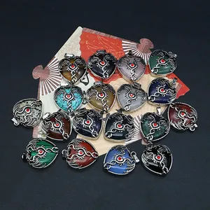 Collection of heart-shaped natural stone pendants with silver dragon wrap on black background