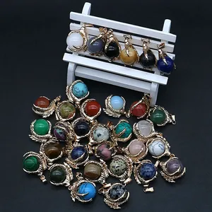 Golden dragon claw pendants with various round natural crystal gemstones and turquoise stones