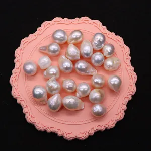 Lustrous white Edison baroque pearls with tail for DIY jewelry making on pink tray