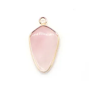 Detailed close-up of shield-shaped pink quartz stone pendant with gold plating finish