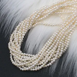 Natural freshwater pearl strand with soft white luster on white plush background
