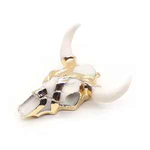 Macro detail of resin bull skull pendant with gold plating for hip-hop jewelry making
