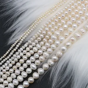 Natural white freshwater pearl strands with iridescent luster and threaded textures