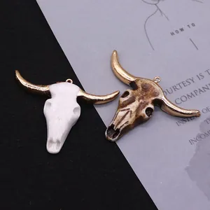 Bull skull resin pendants with golden horns in white and vintage brown styles