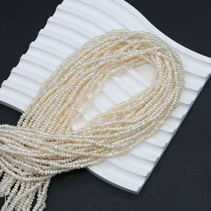 Strands of white natural freshwater pearls for DIY jewelry making on black background