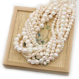 Natural white freshwater pearls set in bamboo tray for DIY jewelry making and necklace