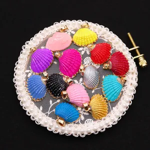 Colorful shell pendants with gold plated edges and metallic loops for DIY jewelry making