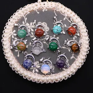 Dolphin necklaces with diverse natural stones including turquoise and amethyst