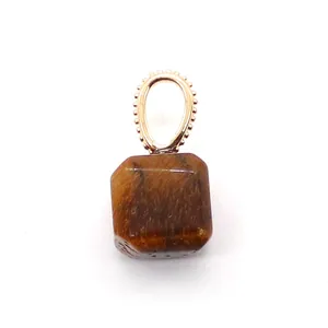 Close-up of square tiger eye stone pendant with rose gold beaded oval metal ring loop
