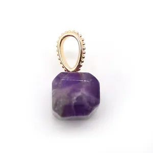 Macro view of square cut purple amethyst pendant with rose gold granulation bail