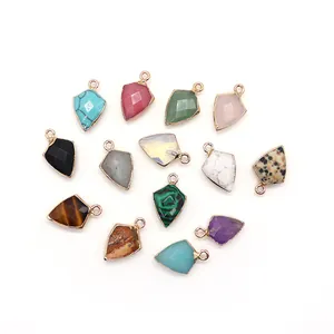 Shield-shaped natural stone pendants with gold plated edges in various colors and textures