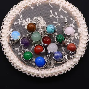 Mixed natural stone dolphin bead pendants with silver plated mounts on lace tray