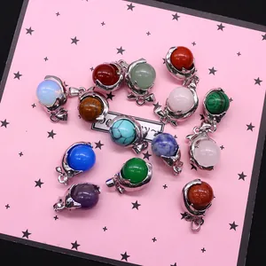 Variety of dolphin-shaped natural stone pendants in silver settings for DIY jewelry making