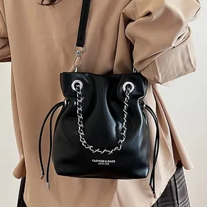 Black leather bucket bag with silver chain and drawstring for women's crossbody wear
