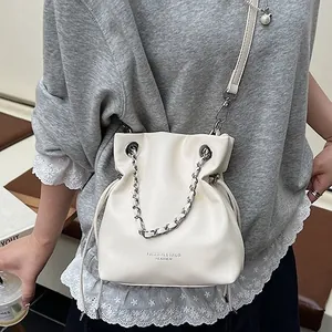 Off-white large capacity bucket bag with metal chain strap and leather texture