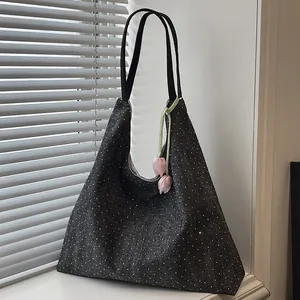 Black denim tote bag with white polka dots and pink tulip charm for women's daily commute