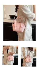 Detailed views of a pink leather crossbody bag with top handles and golden hardware