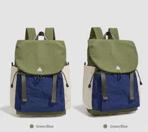 Farbdisplay eines weichen, wasserabweisenden Outdoor-Rucksacks in Grün-Blau-Kombination