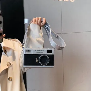 Vintage camera-shaped crossbody bag in silver and black PU leather with wide strap