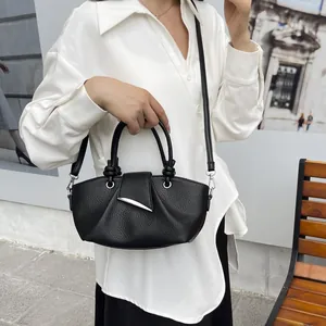 Vintage pleated black bucket bag with lychee pattern leather and crescent silver metal buckle