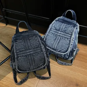 Classic denim backpacks in black and blue wash with vintage cross-stitch and large capacity